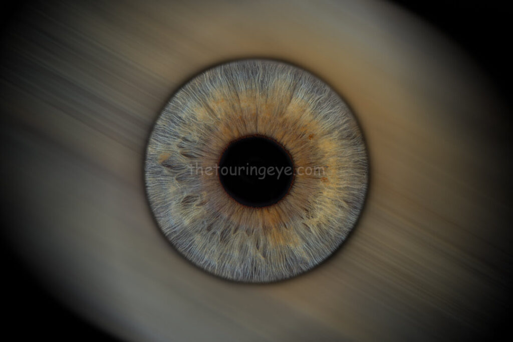 Motion blur. A single eye iris on a blurry background. Iris photography. Eye photography. The Touring Eye. UK